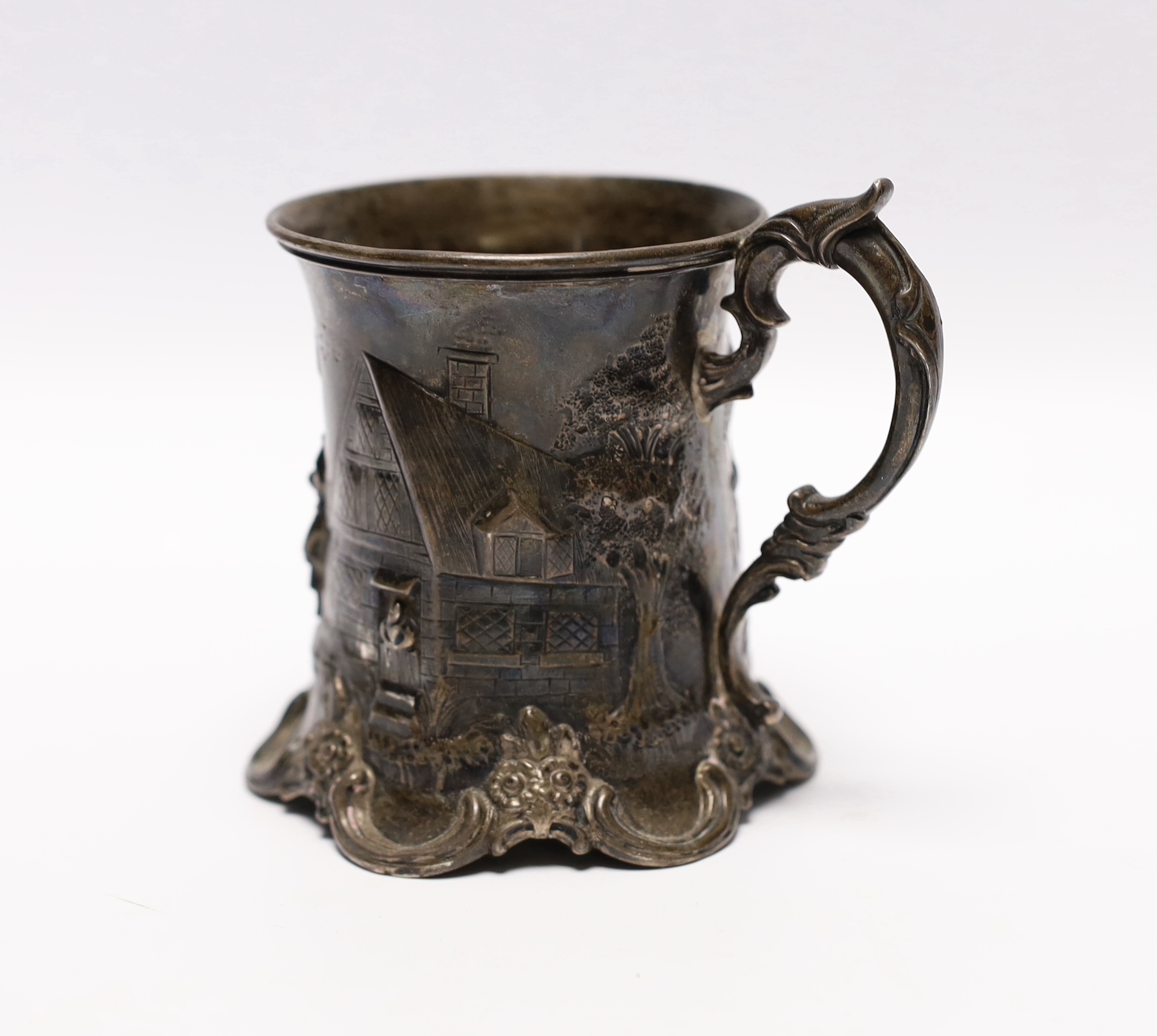 A Victorian embossed silver christening mug, by Robert Harper, London, 1860, 10cm, 6.3oz.